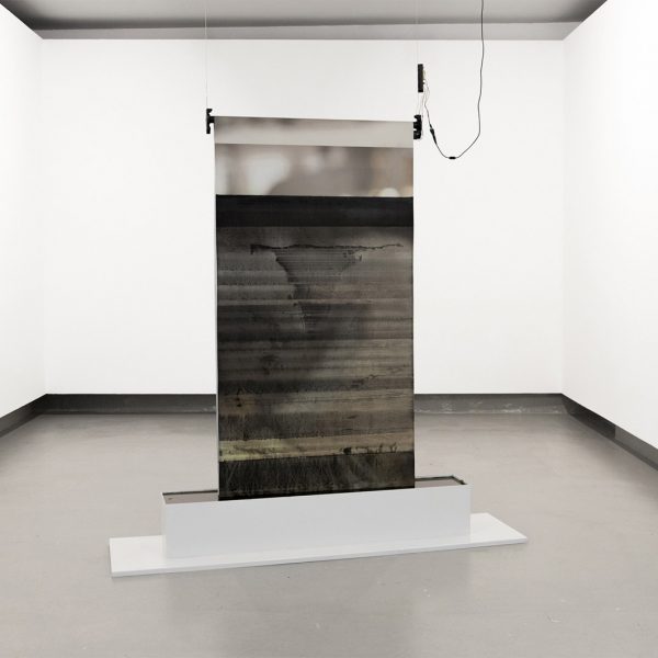 Bruno José Silva - LIMIT OF DISAPPEARANCE - Sculpture Materials (steel, textile printing, ivory black oil paint, linseed oil) and Mechanism (roller blind, 5V motor, 9V DC Power Supply adapter, NodeMCU Lolin V3, software, 3D printing and sensor) Variable Dimensions - 2022